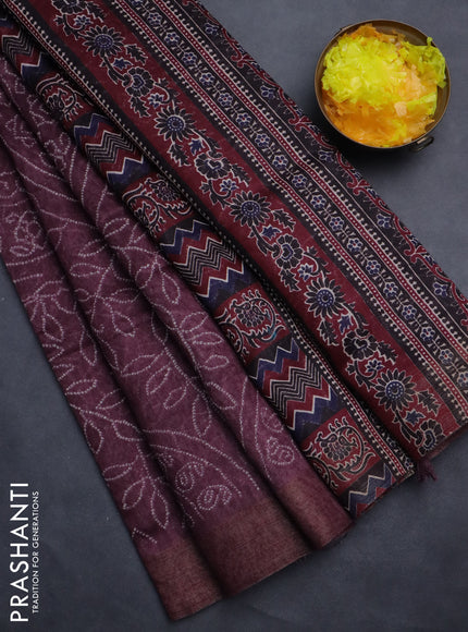 Semi linen saree wine shade with allover bandhani prints and ajrakh printed pallu & blouse