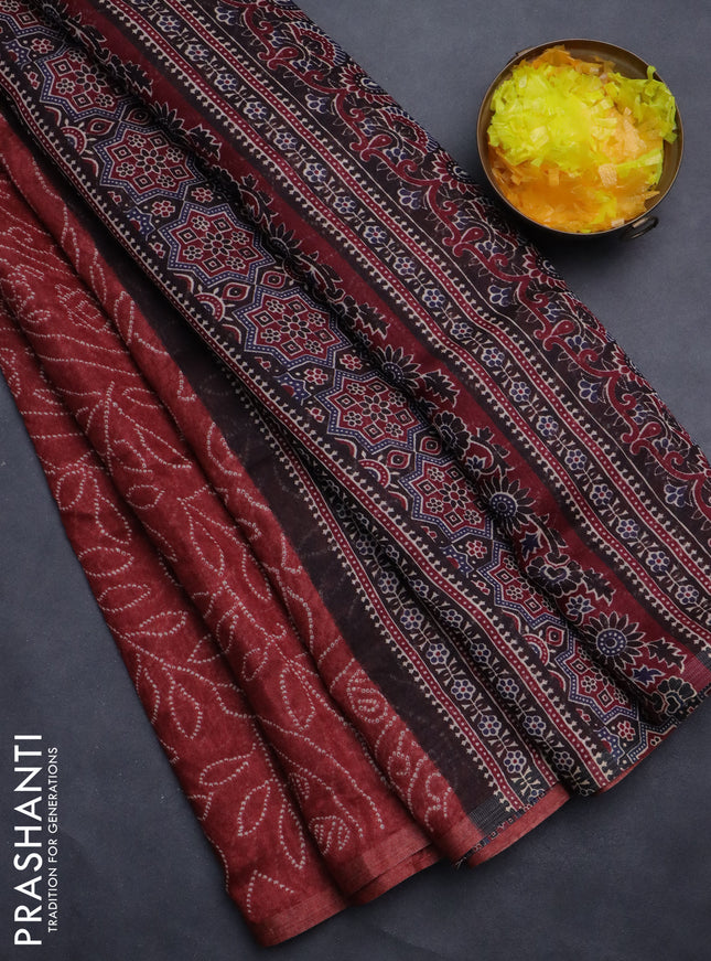 Semi linen saree maroon with allover bandhani prints and ajrakh printed pallu & blouse