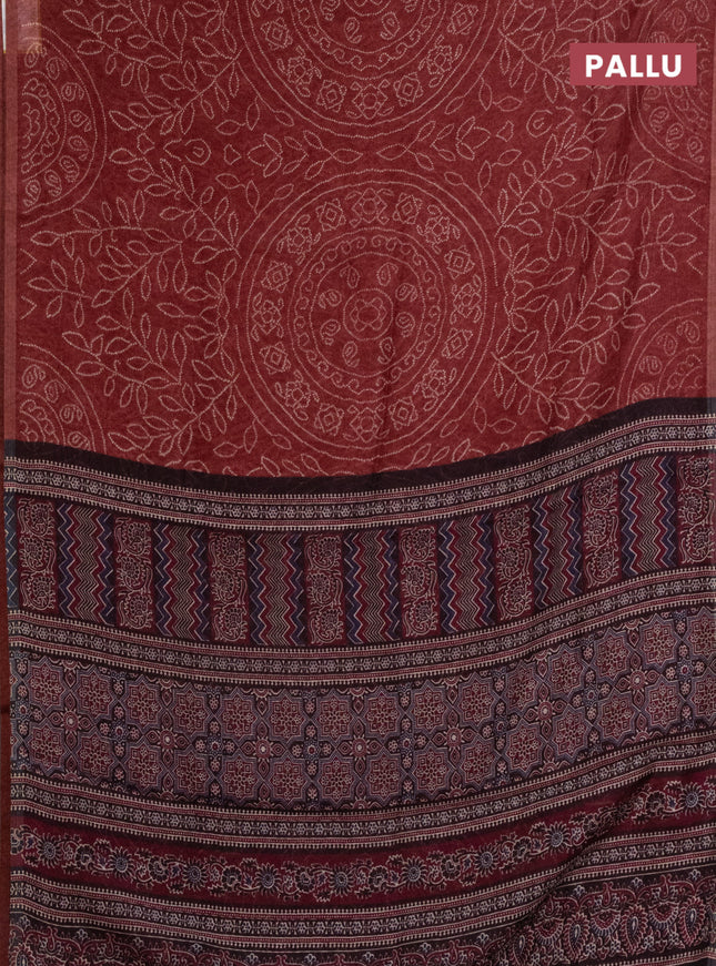 Semi linen saree maroon with allover bandhani prints and ajrakh printed pallu & blouse