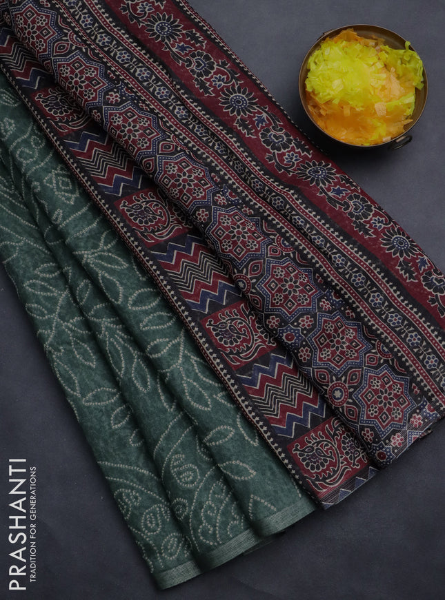 Semi linen saree green with allover bandhani prints and ajrakh printed pallu & blouse
