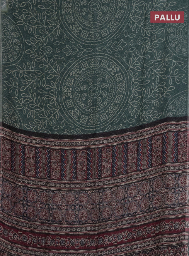 Semi linen saree green with allover bandhani prints and ajrakh printed pallu & blouse