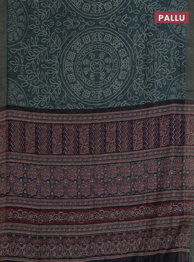 Semi linen saree bottle green with allover bandhani prints and ajrakh printed pallu & blouse