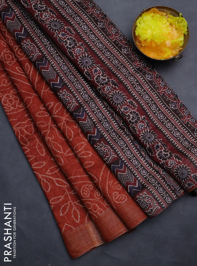 Semi linen saree rust shade with allover bandhani prints and ajrakh printed pallu & blouse