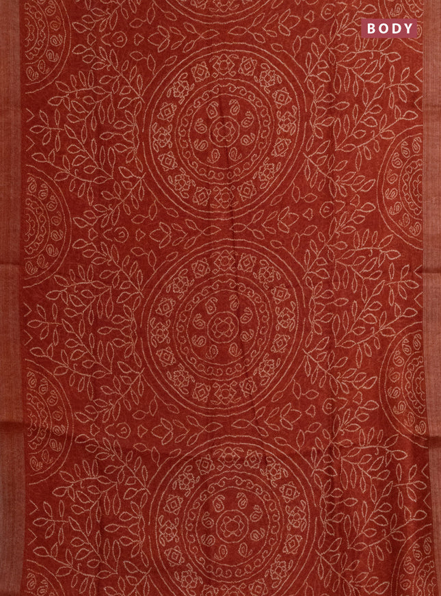 Semi linen saree rust shade with allover bandhani prints and ajrakh printed pallu & blouse