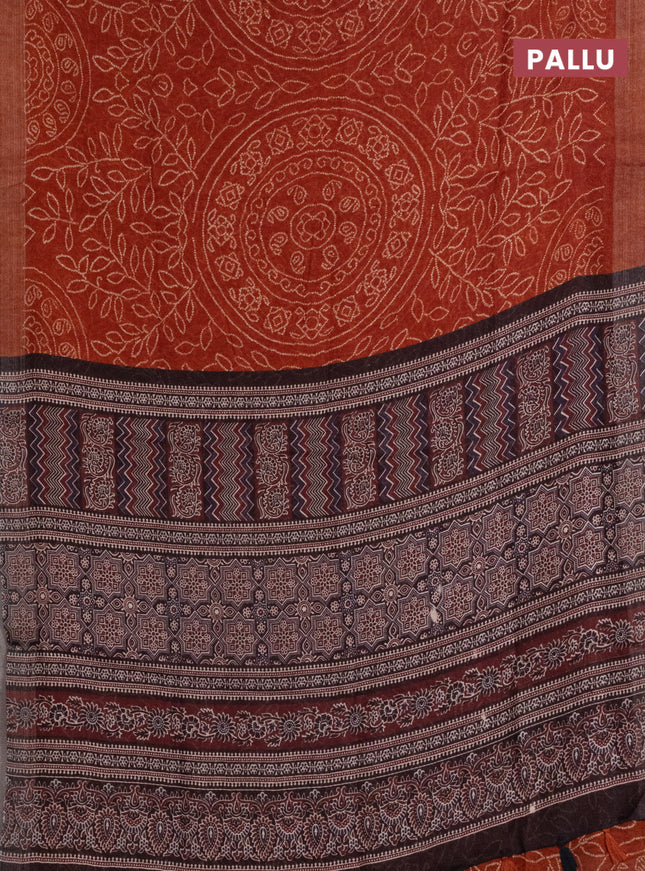 Semi linen saree rust shade with allover bandhani prints and ajrakh printed pallu & blouse