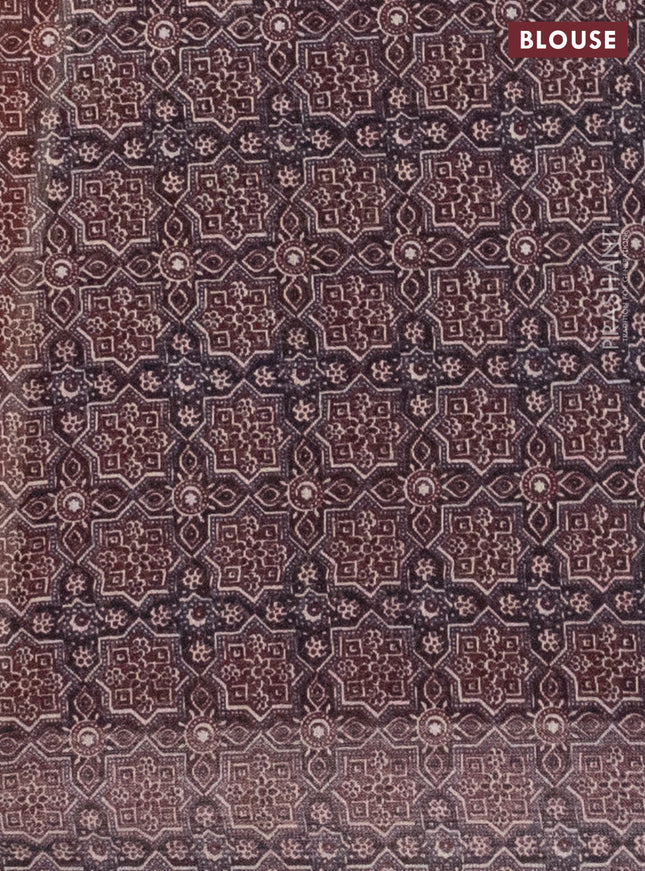 Semi linen saree rust shade with allover bandhani prints and ajrakh printed pallu & blouse