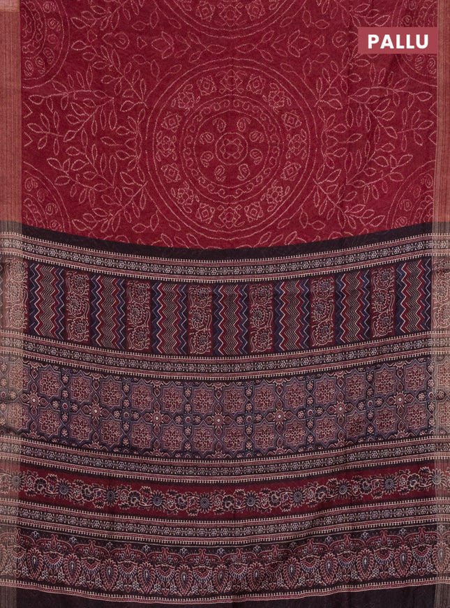 Semi linen saree maroon with allover bandhani prints and ajrakh printed pallu & blouse