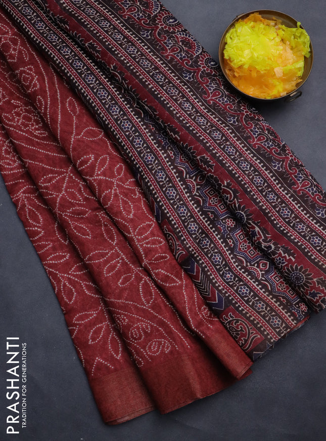 Semi linen saree maroon with allover bandhani prints and ajrakh printed pallu & blouse