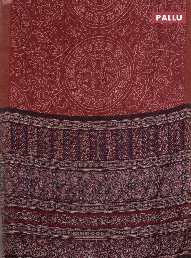 Semi linen saree maroon with allover bandhani prints and ajrakh printed pallu & blouse