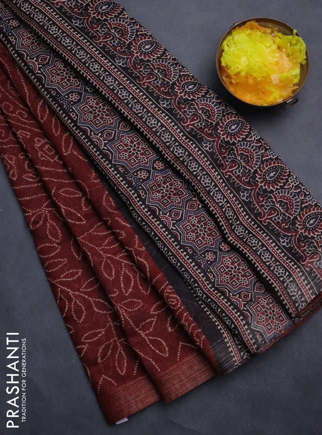 Semi linen saree maroon with allover bandhani prints and ajrakh printed pallu & blouse