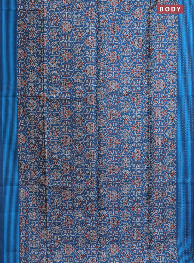 Semi tussar saree cs blue with allover ajrakh prints and katha stitch work pallu & border
