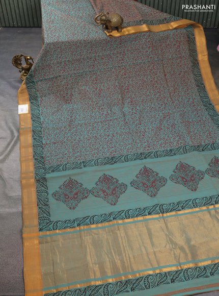 Mangalgiri cotton block printed saree dual shade of teal bluish mustard with allover prints and zari woven border
