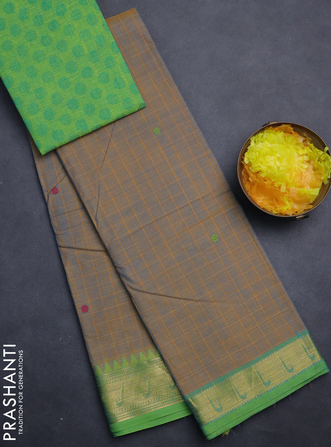 Chettinad cotton saree dual shade of bluish mustard and green with allover checks & buttas and zari woven muniya style border
