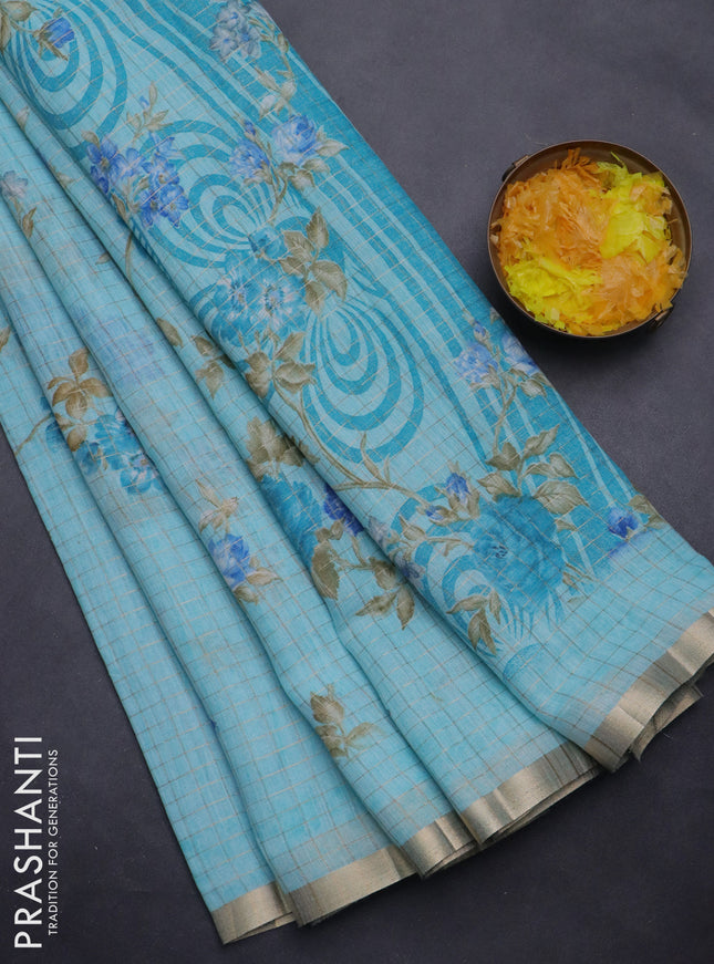 Linen cotton saree light blue with allover floral prints & zari checks and zari woven border
