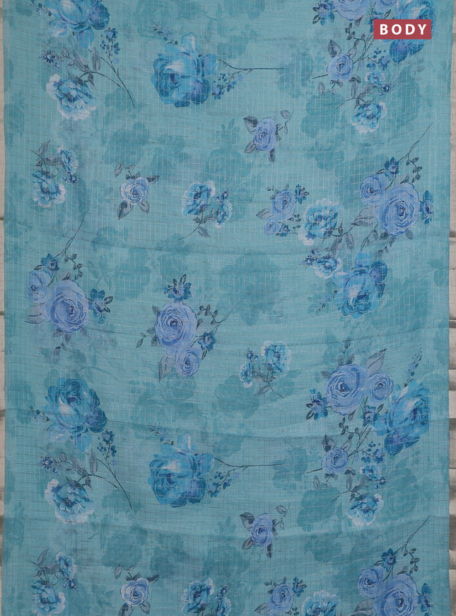 Linen cotton saree teal blue with allover floral prints & zari checks and zari woven border