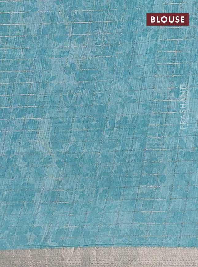 Linen cotton saree teal blue with allover floral prints & zari checks and zari woven border