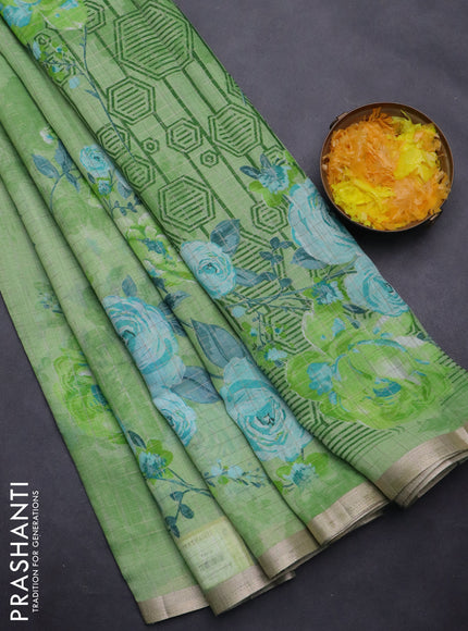 Linen cotton saree light green with allover floral prints & zari checks and zari woven border