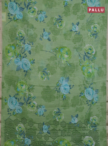 Linen cotton saree light green with allover floral prints & zari checks and zari woven border
