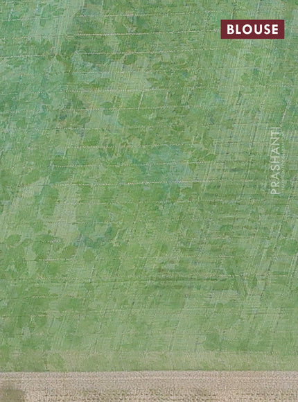 Linen cotton saree light green with allover floral prints & zari checks and zari woven border