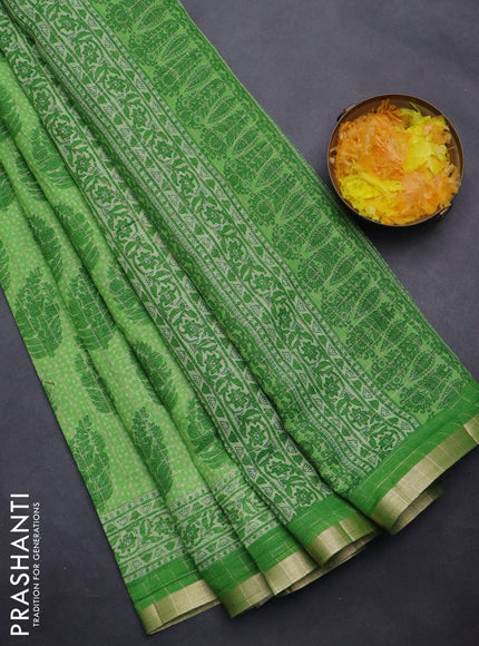 Linen cotton saree green with allover butta prints & zari checks and zari woven border