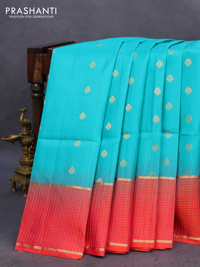 Pure soft silk saree teal blue shade and dual shade of pinkish orange with zari woven buttas and zari woven checked border