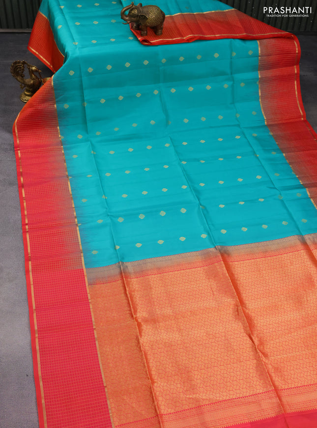 Pure soft silk saree teal blue shade and dual shade of pinkish orange with zari woven buttas and zari woven checked border