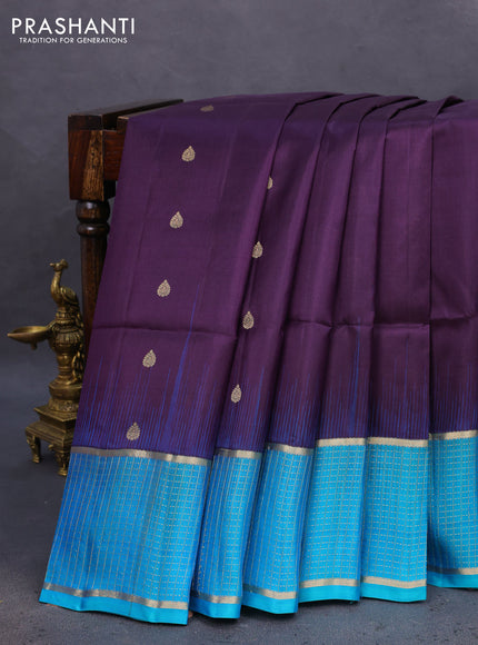 Pure soft silk saree deep purple and teal blue with allover zari woven buttas and zari woven checked border