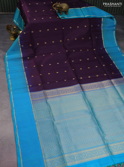 Pure soft silk saree deep purple and teal blue with allover zari woven buttas and zari woven checked border