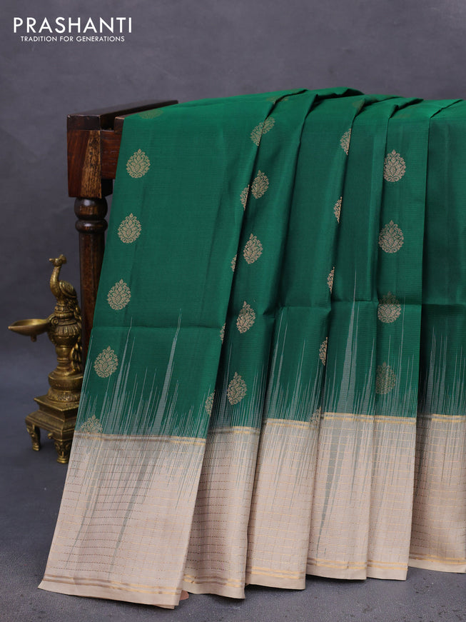 Pure soft silk saree green and beige with allover zari woven buttas and zari woven checked border