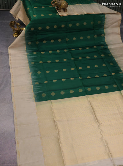 Pure soft silk saree green and beige with allover zari woven buttas and zari woven checked border