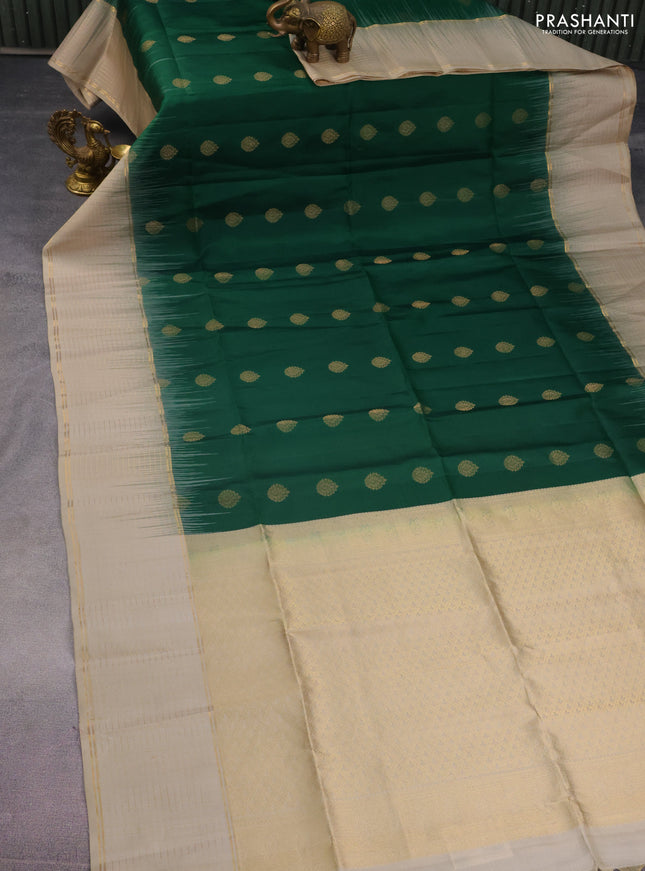 Pure soft silk saree green and beige with allover zari woven buttas and zari woven checked border