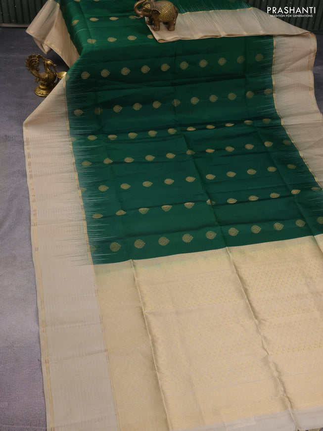 Pure soft silk saree green and beige with allover zari woven buttas and zari woven checked border