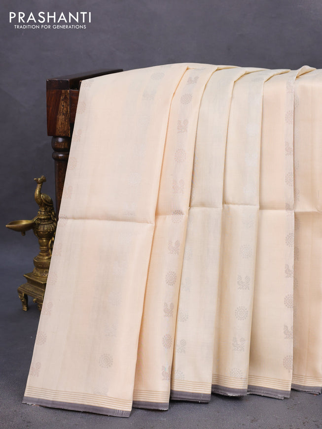 Pure soft silk saree cream and coffee brown with silver & gold zari woven buttas and small zari woven border