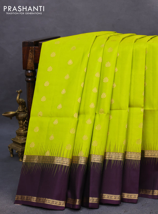 Pure soft silk saree fluorescent green and deep purple with allover zari woven buttas and rettapet zari woven border