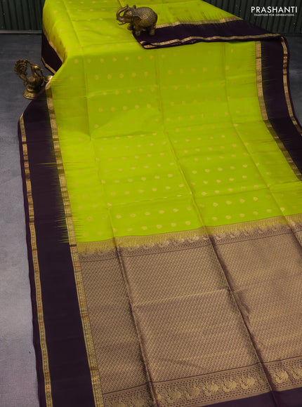 Pure soft silk saree fluorescent green and deep purple with allover zari woven buttas and rettapet zari woven border