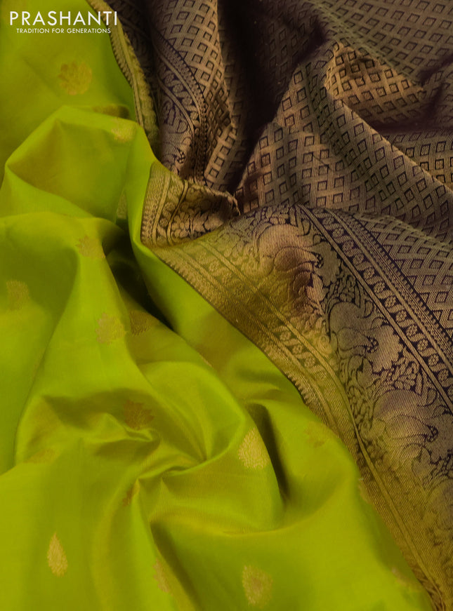 Pure soft silk saree fluorescent green and deep purple with allover zari woven buttas and rettapet zari woven border