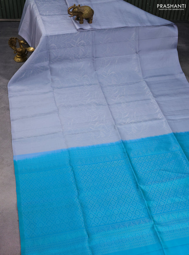 Pure soft silk saree grey and teal bluish green with allover silver woven brocade weaves in borderless style