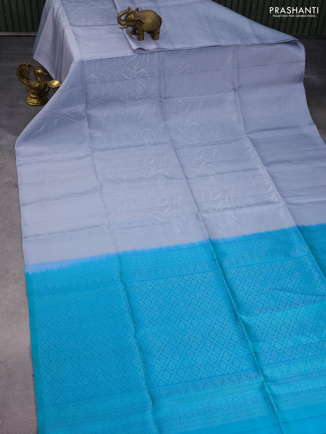 Pure soft silk saree grey and teal bluish green with allover silver woven brocade weaves in borderless style