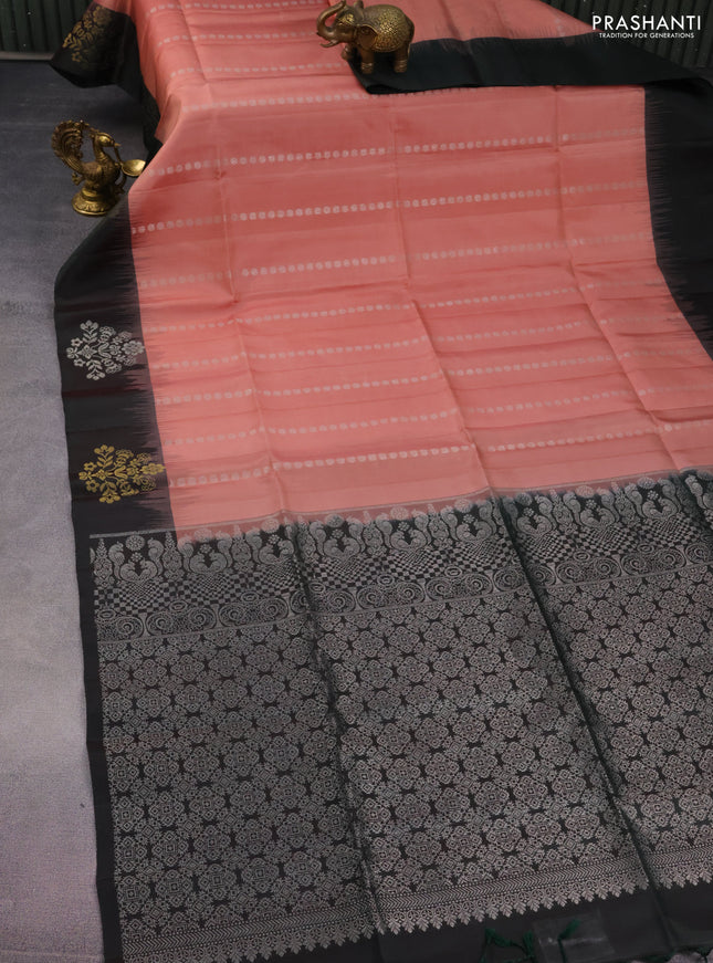 Pure soft silk saree peach shade and bottle green with allover silver zari woven buttas and zari woven buttas border