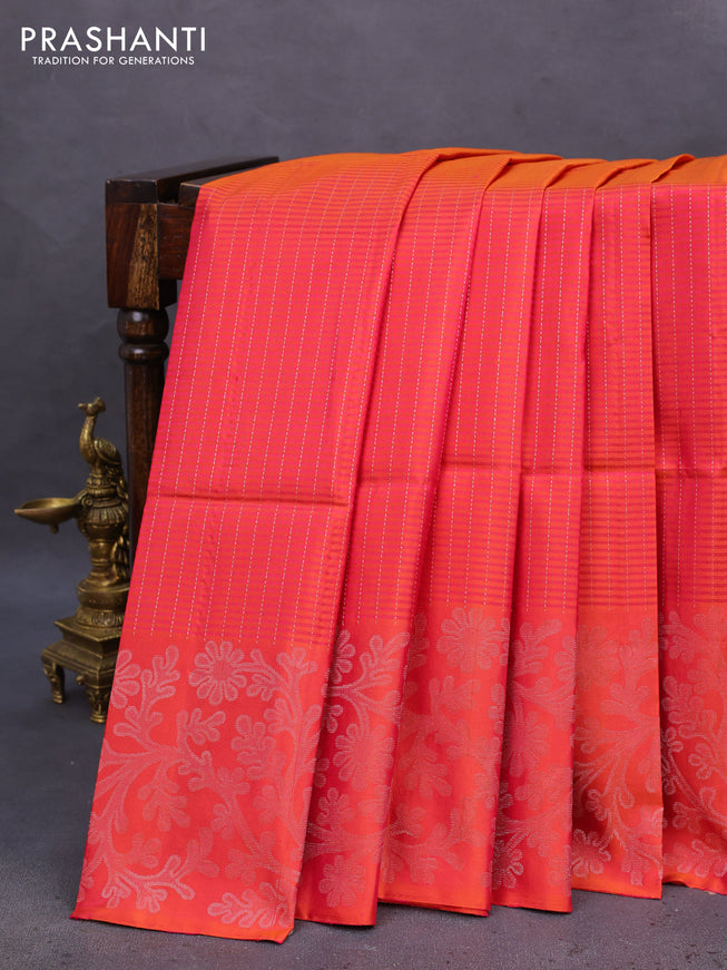 Pure soft silk saree dual shade of pinkish orange with allover silver zari stripe pattern and long silver zari woven border