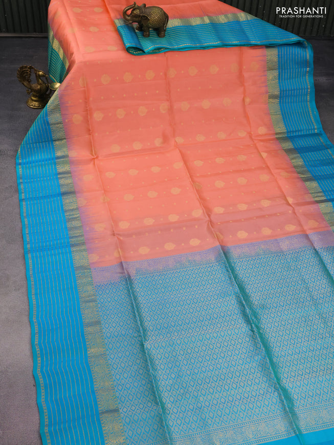 Pure soft silk saree peach orange and dual shade of bluish green with allover zari woven buttas and zari woven border
