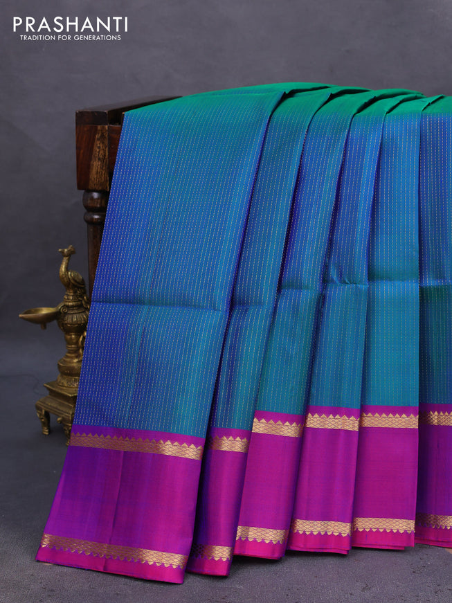 Pure soft silk saree dual shade of teal blue and purple with allover zari wevaes and rettapet zari woven border
