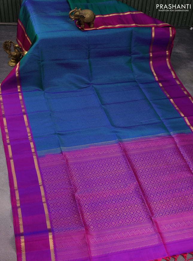 Pure soft silk saree dual shade of teal blue and purple with allover zari wevaes and rettapet zari woven border