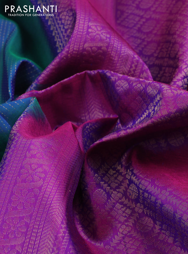 Pure soft silk saree dual shade of teal blue and purple with allover zari wevaes and rettapet zari woven border