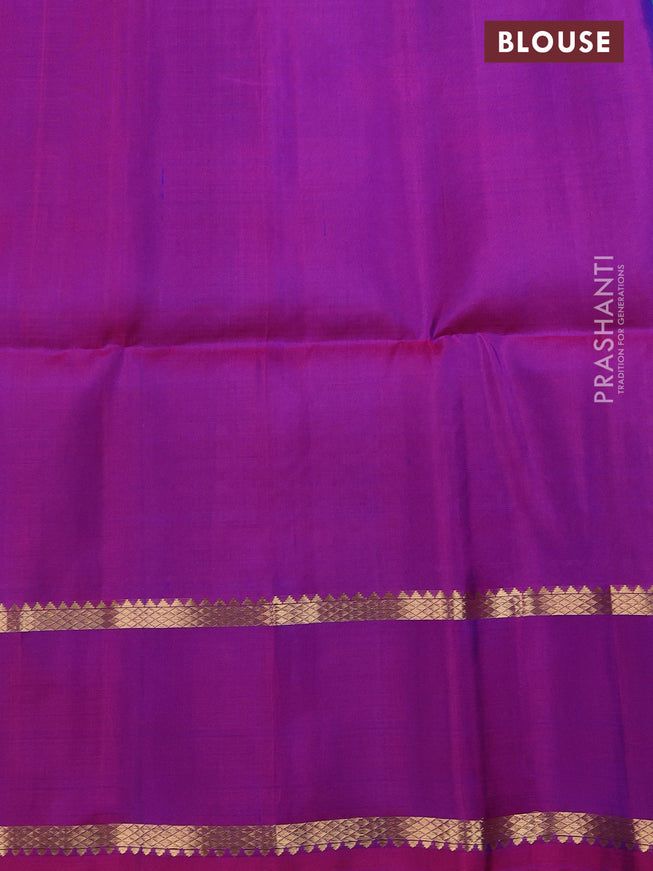 Pure soft silk saree dual shade of teal blue and purple with allover zari wevaes and rettapet zari woven border