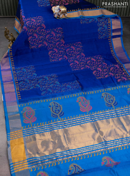 Silk cotton block printed saree blue and cs blue with allover prints and zari woven border