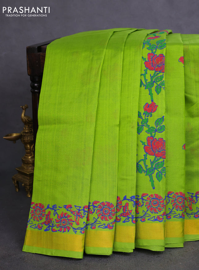 Silk cotton block printed saree light green with allover floral prints and zari woven border