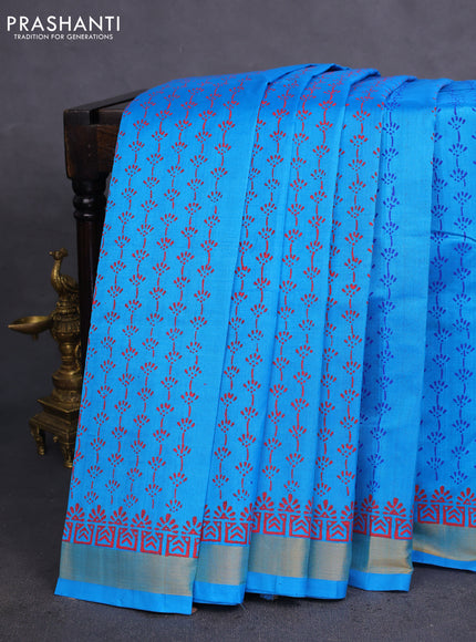 Silk cotton block printed saree cs blue with allover prints and zari woven border