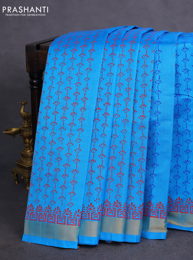 Silk cotton block printed saree cs blue with allover prints and zari woven border