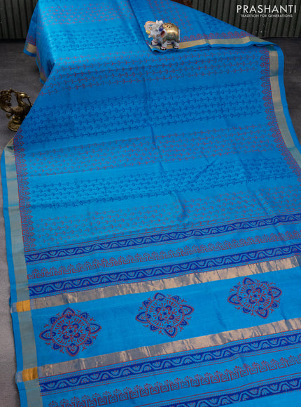 Silk cotton block printed saree cs blue with allover prints and zari woven border